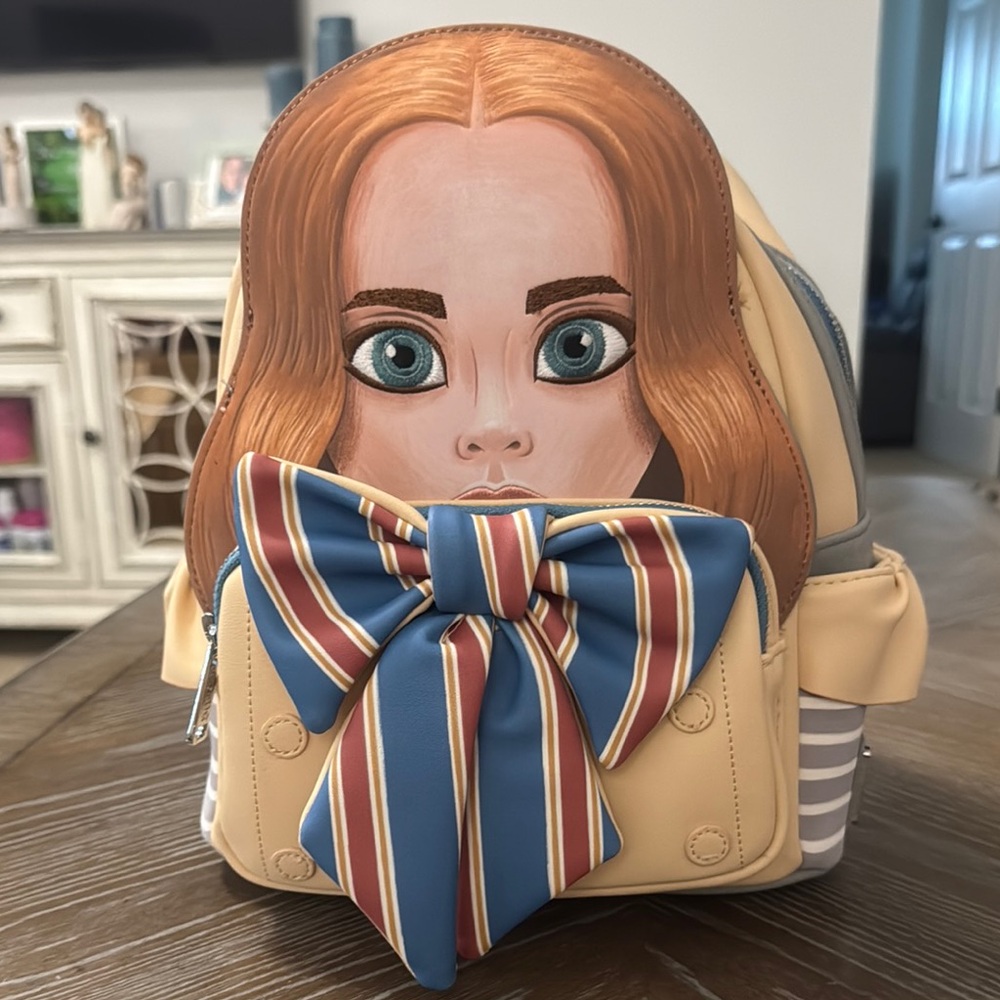 Megan Loungefly Backpack with Face Design and Bow